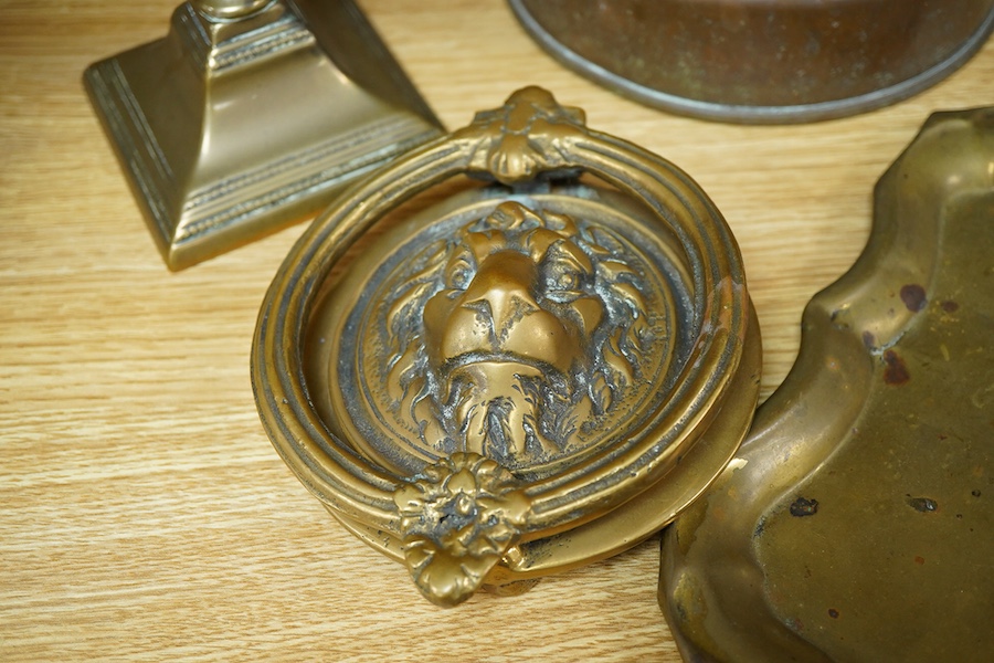 Four items of metalware comprising a candlestick, door knocker, tray and kettle, largest 26cm high